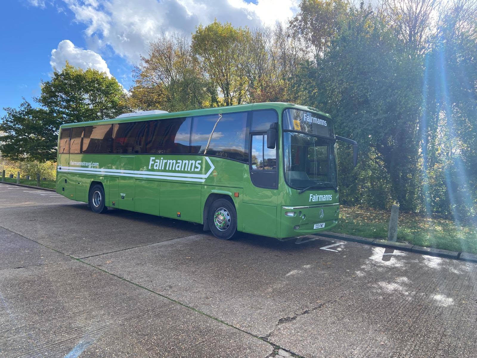 Green Fairmanns coach at the depot